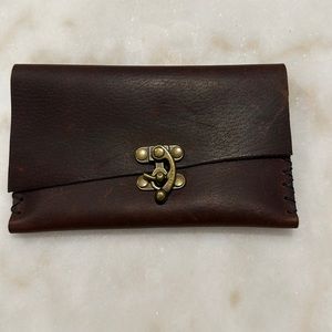 Title: Groovy Hand-Crafted Dark Brown Leather Pouch